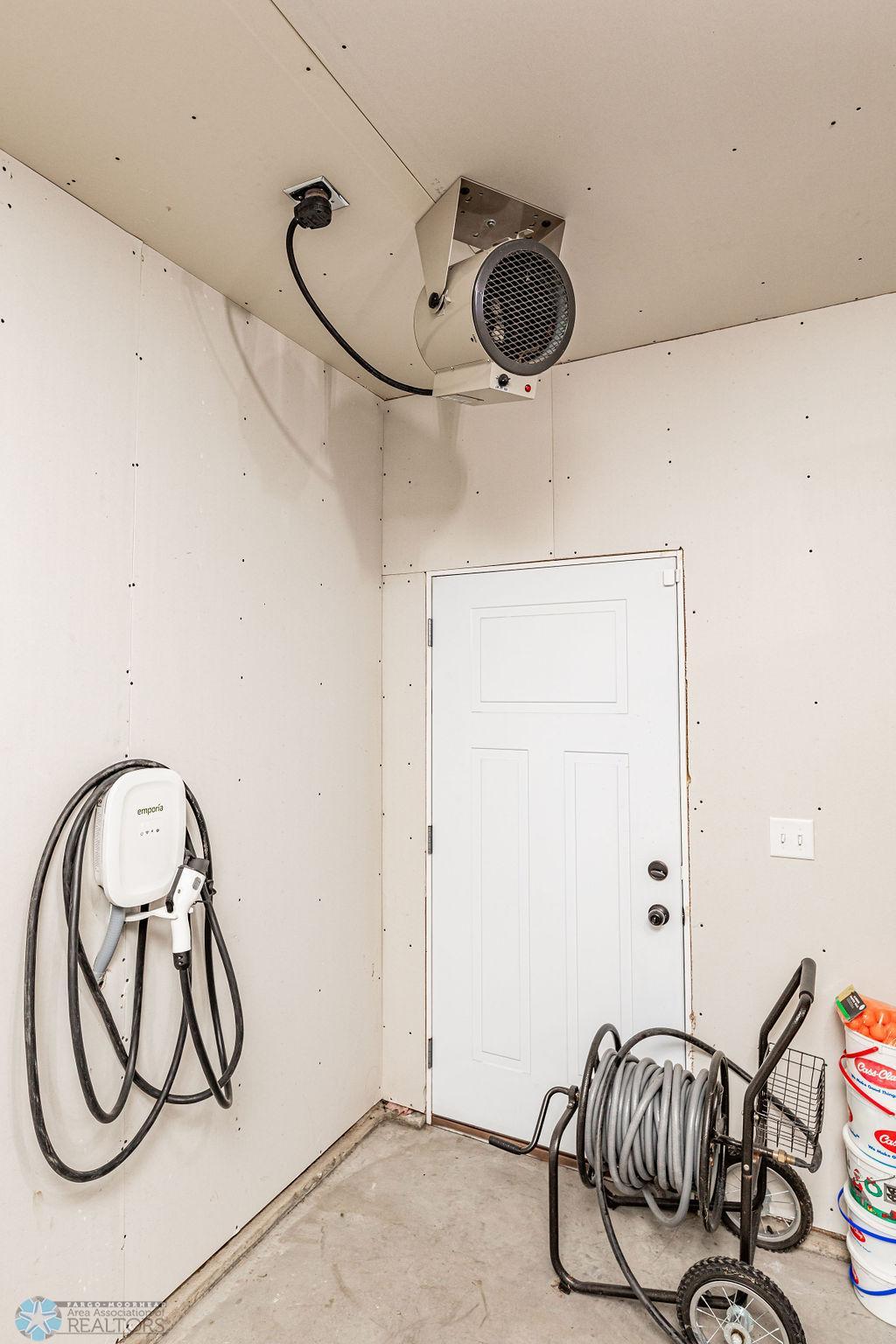 Access to backyard. Electric car charger. Garage heater.