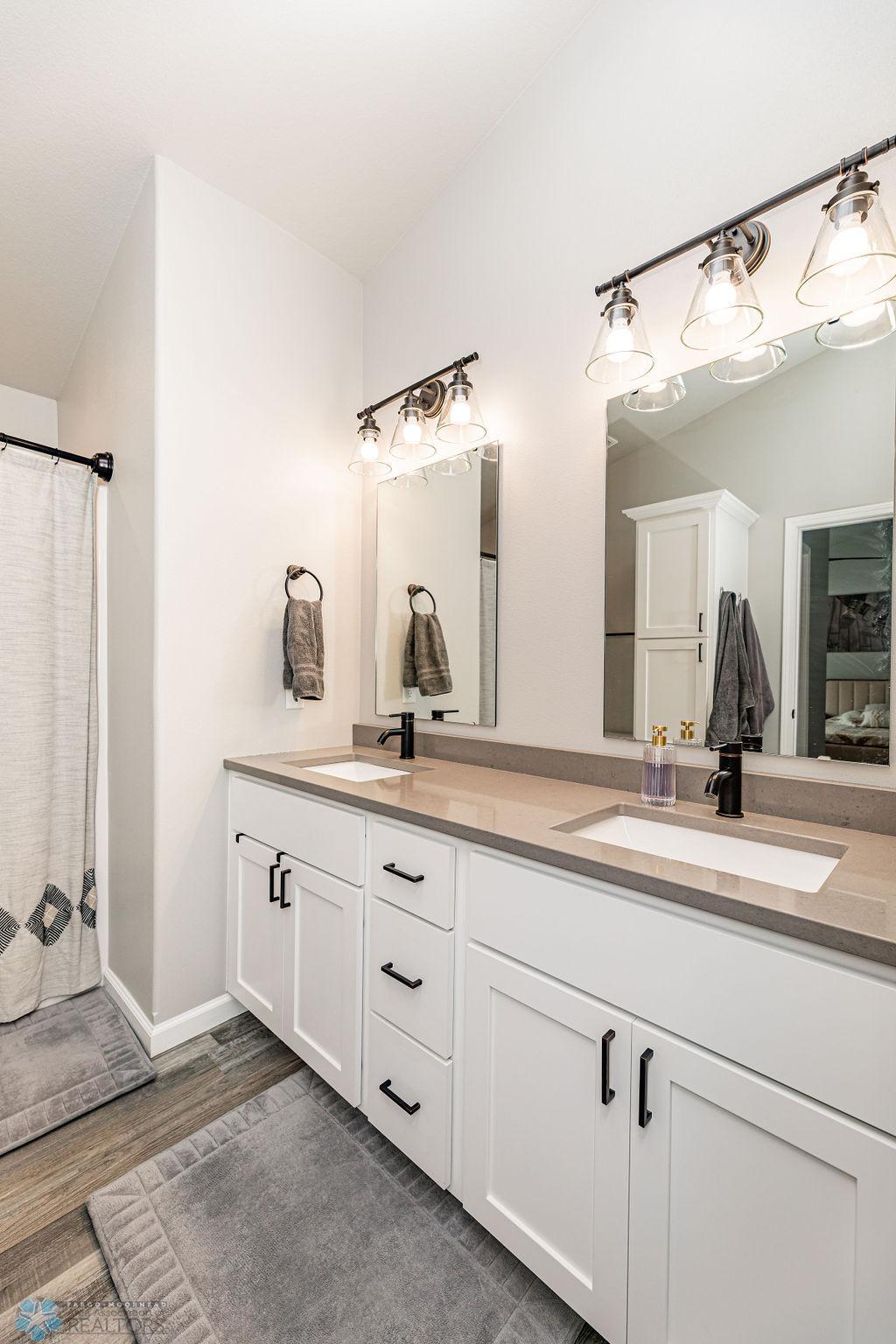 Double sinks. Linen tower cabinet. Lots of storage & counter space.