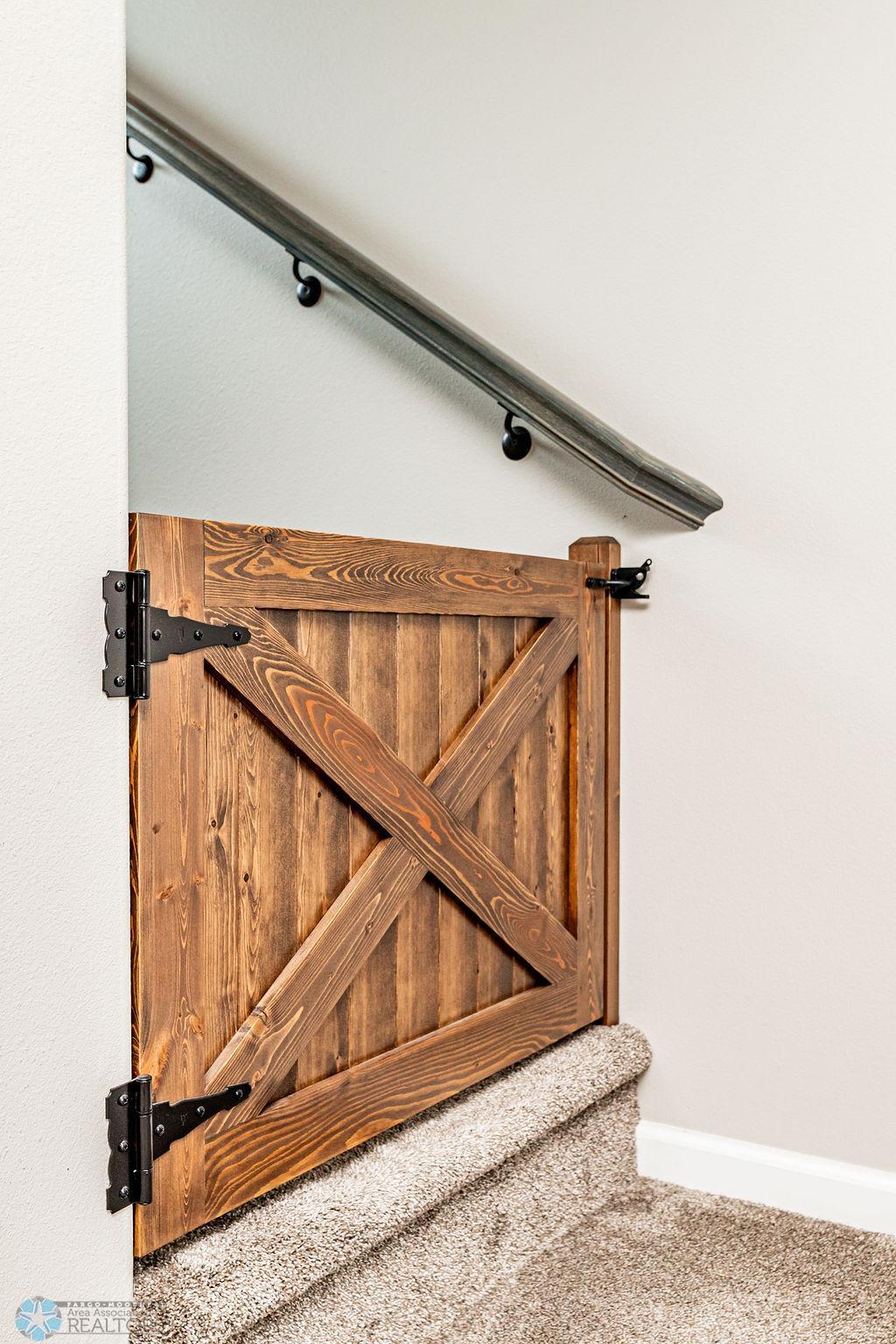 Custom safety gates on both levels conveniently block stairs for little ones or pets!