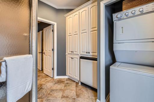 Pool entrance also has bench, washer, dryer, fridge and ton's of closet space