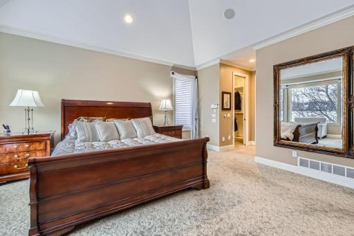 Primary bedroom view leading into his and her closets