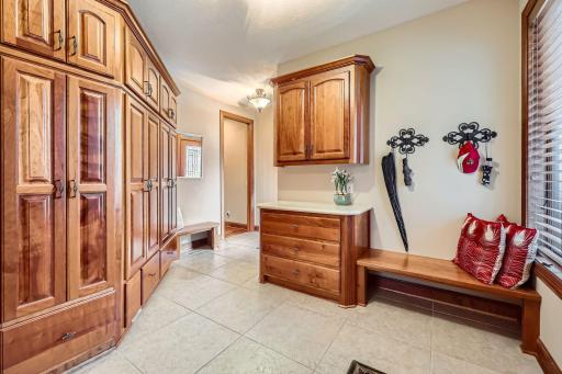 Very large mud room entrance from garage. 2 built-in benches and abundance of built-in closets and storage