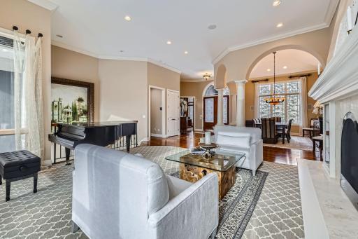 Living room view into the formal dining and foyer