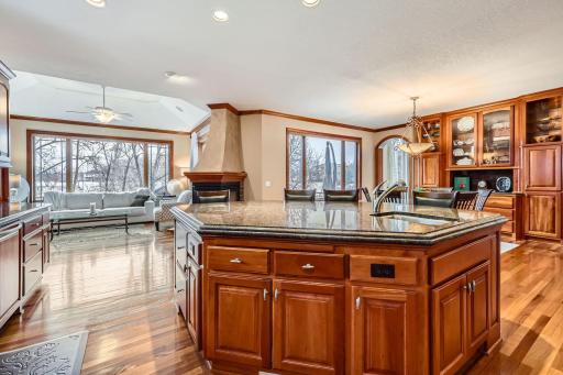 Open kitchen with gorgeous views of wetlands, pool and golf course