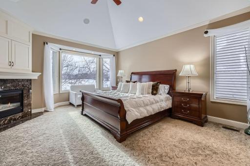 Another view of Primary bedroom with wonderful views of backyard wetlands, pool and golf course