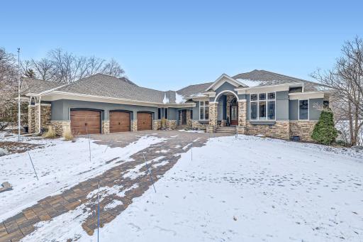 Beautiful landscaping and brick paver driveway
