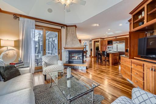 Gorgeous Hearth room with built-ins, 2 sided fireplace looking into the open kitchen
