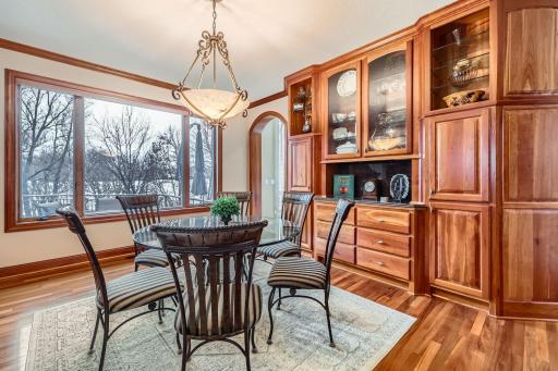 Another view of the informal dining room with a big picture window to the gorgeous backyard views