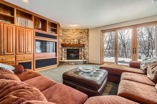 Lower level amusement room with stone gas fireplace
