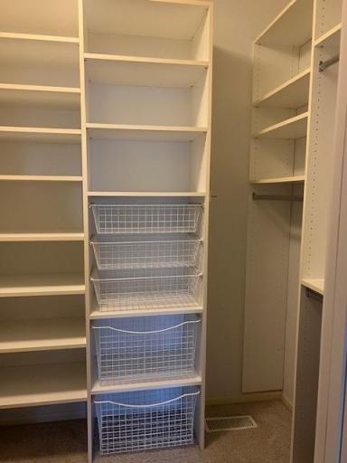 Built-in's in lower level bedroom walk-in closet