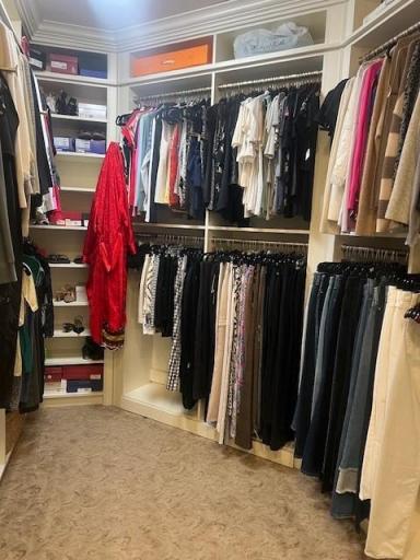 Extra deep primary closet with new built-in system