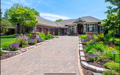 Beautiful walk-out rambler with abundance of beautiful perennials and landscaping