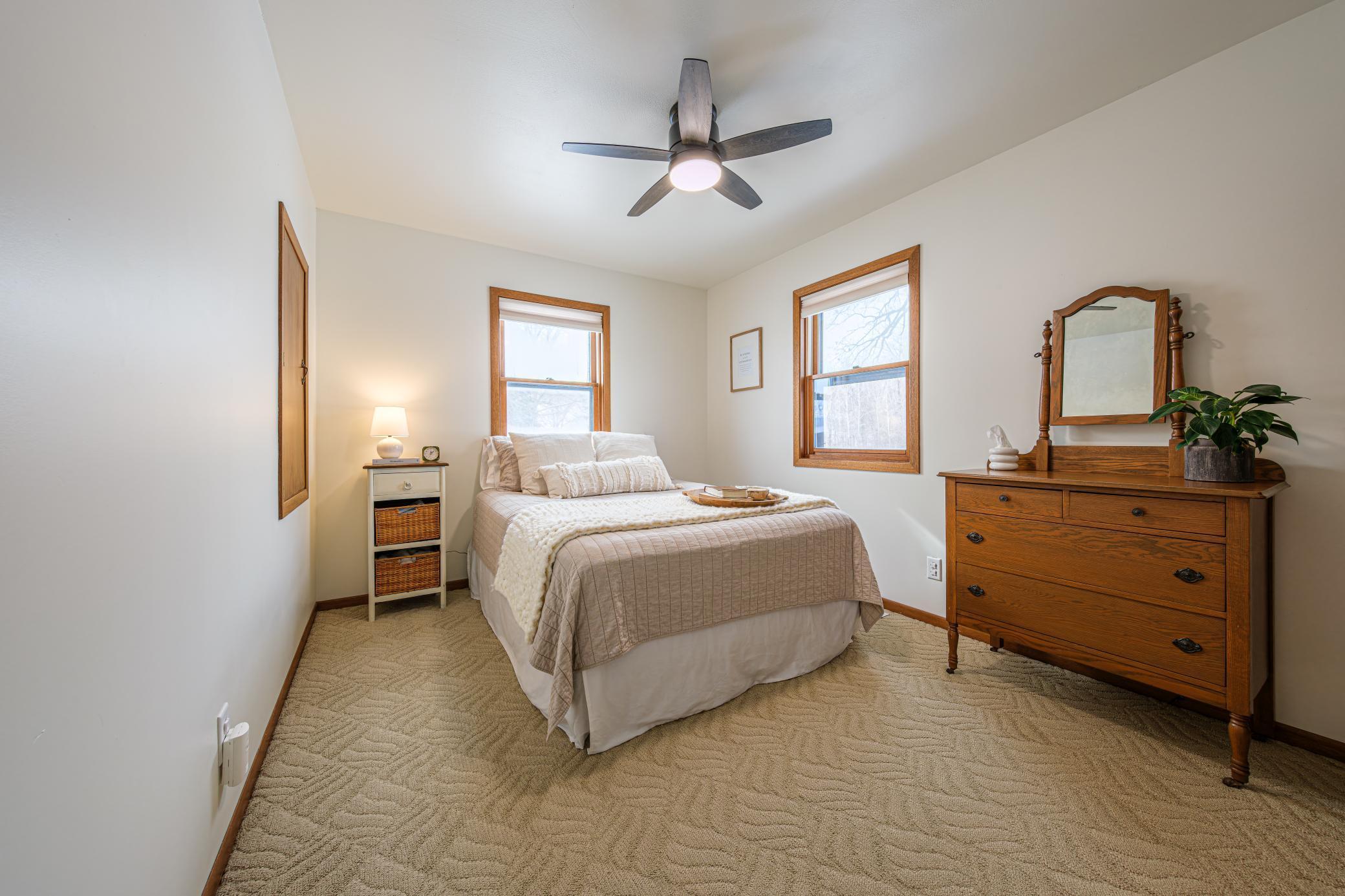 Second bedroom on second floor features additional storage space in closet.
