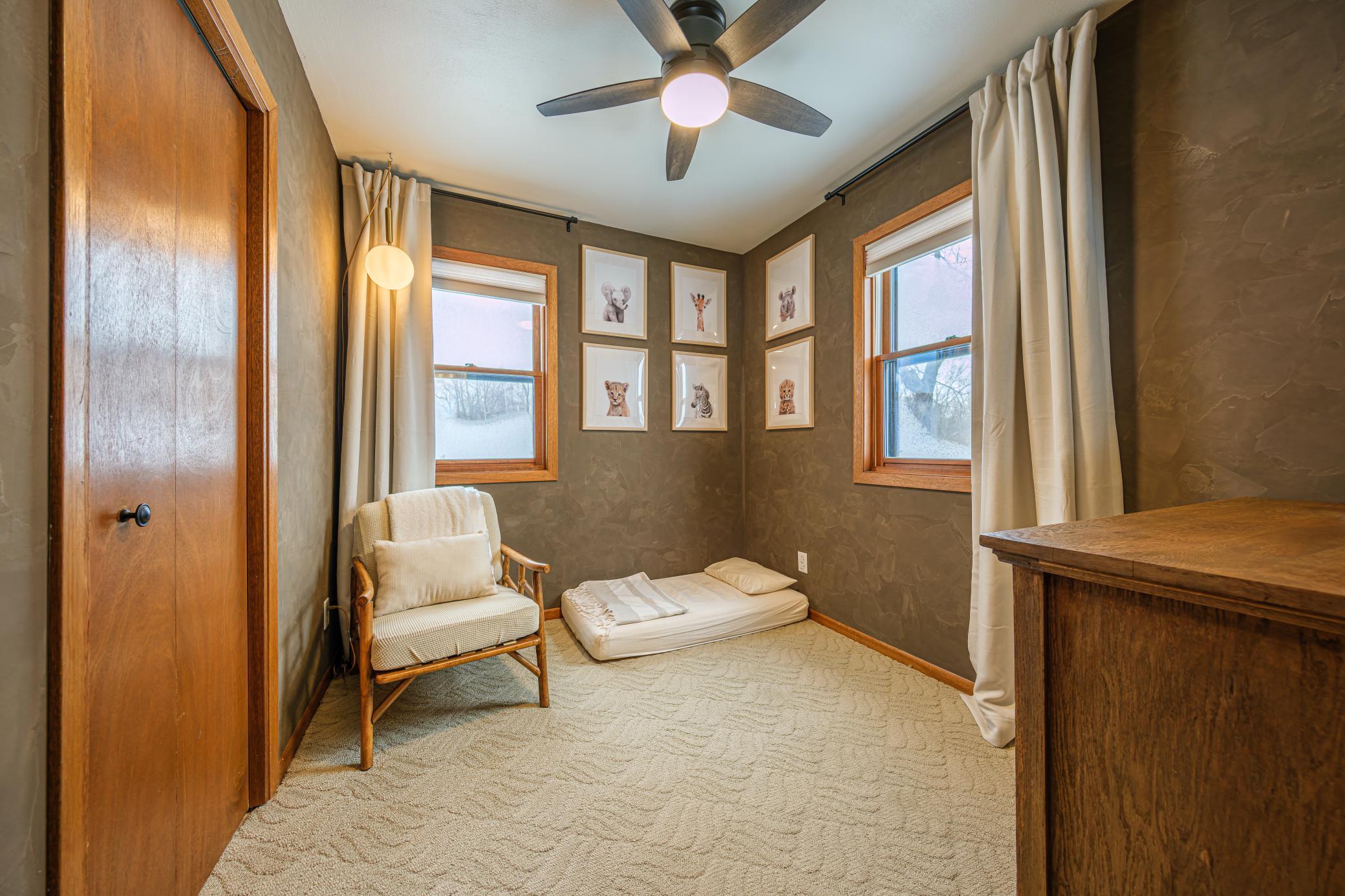 Third bedroom features roman clay walls.