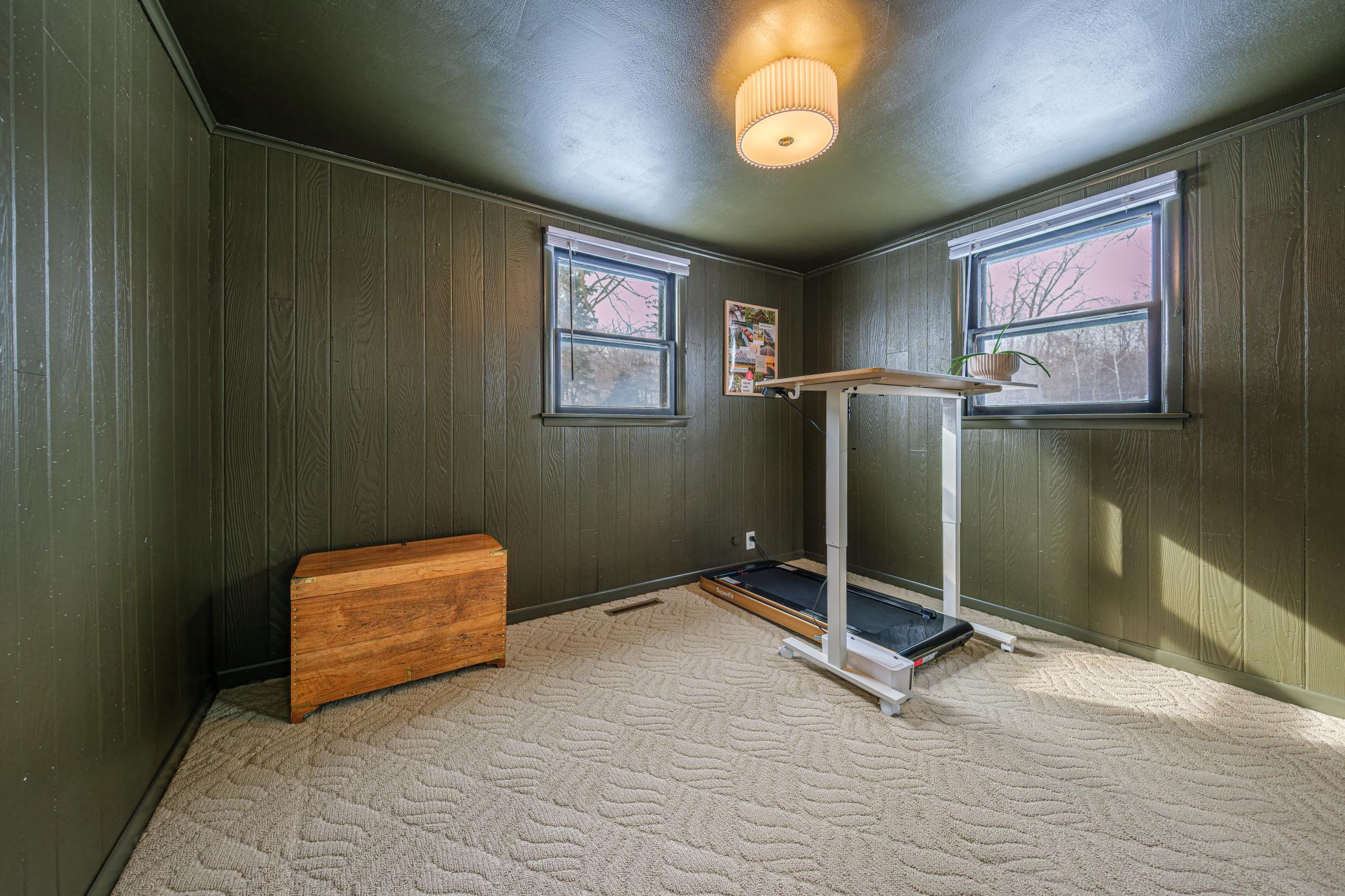 Bedroom on main floor, currently being used as an office and exercise space.