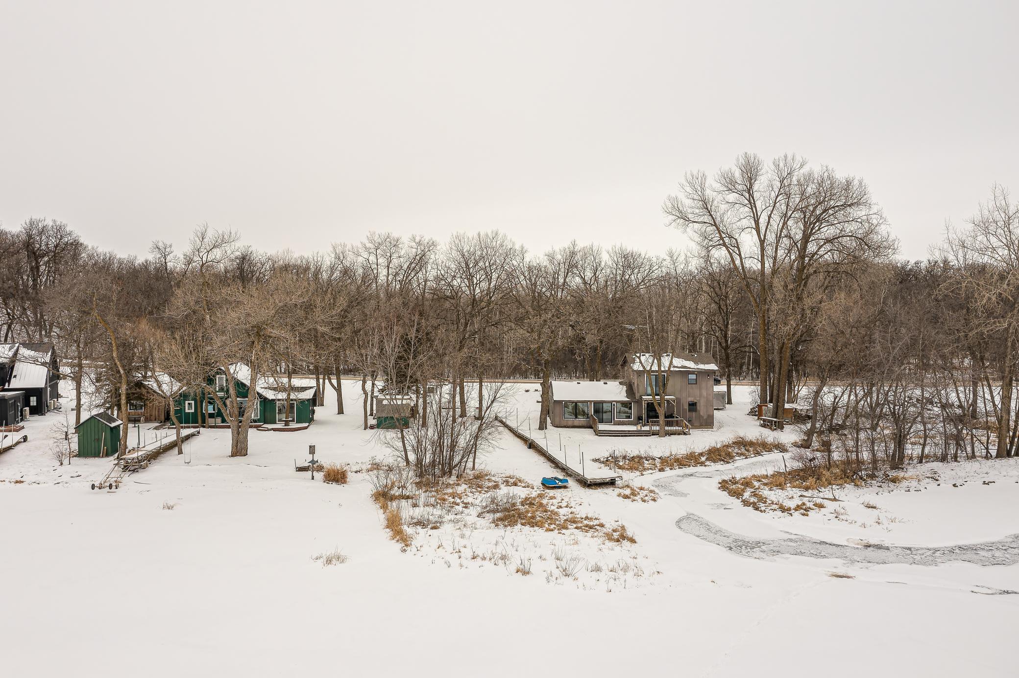This lot sits level with the water, giving easy access to the dock, boats, and lake toys.