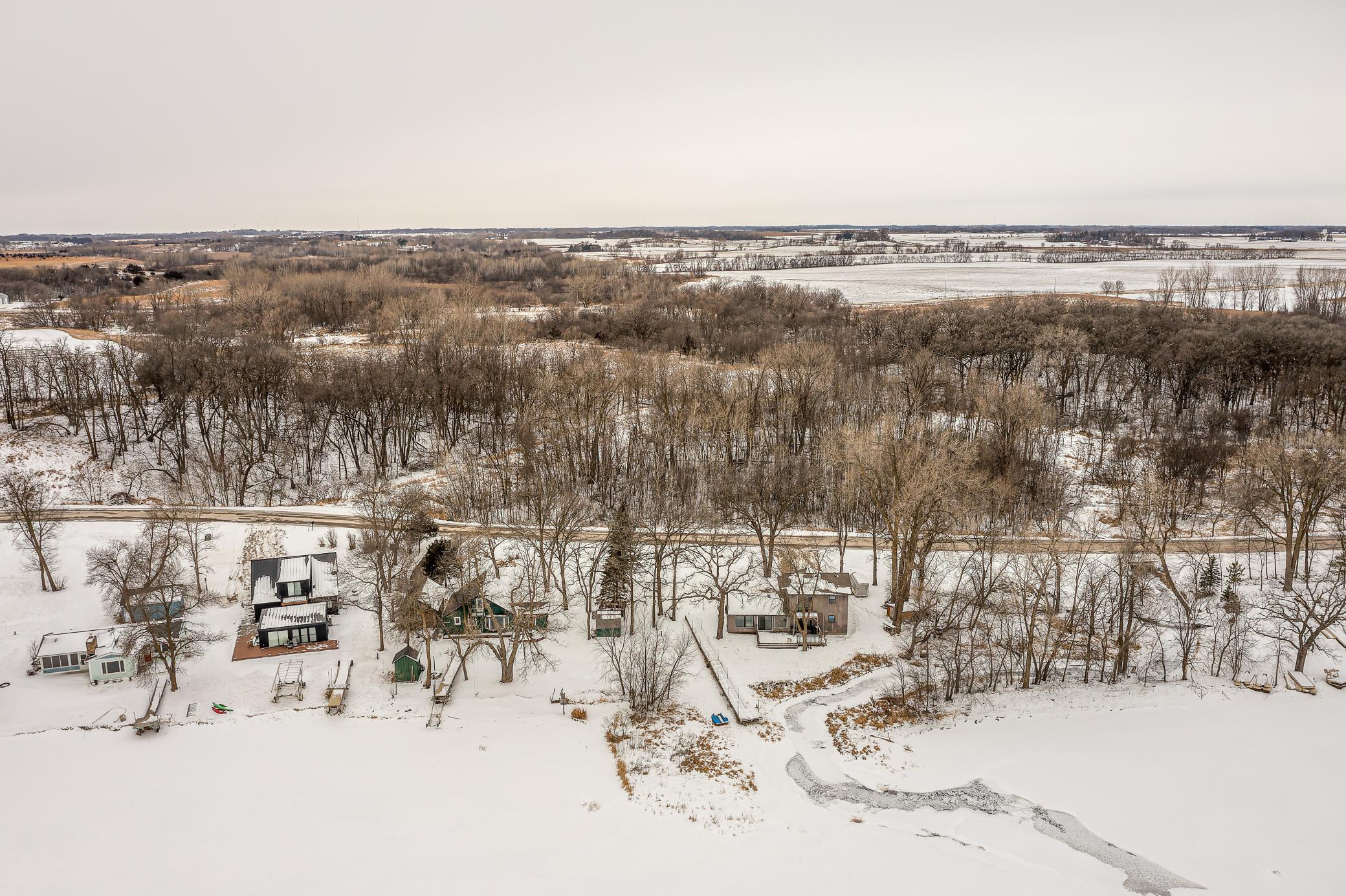 Property features a flat, level lot. Sucker Creek, a natural spring that feeds the lake, runs alongside the property.