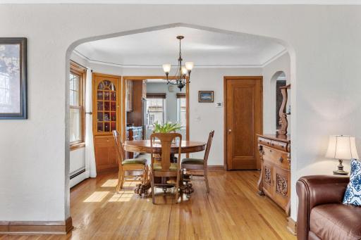 The formal dining room features a tray ceiling and built-in cabinetry, offering elegance and functionality