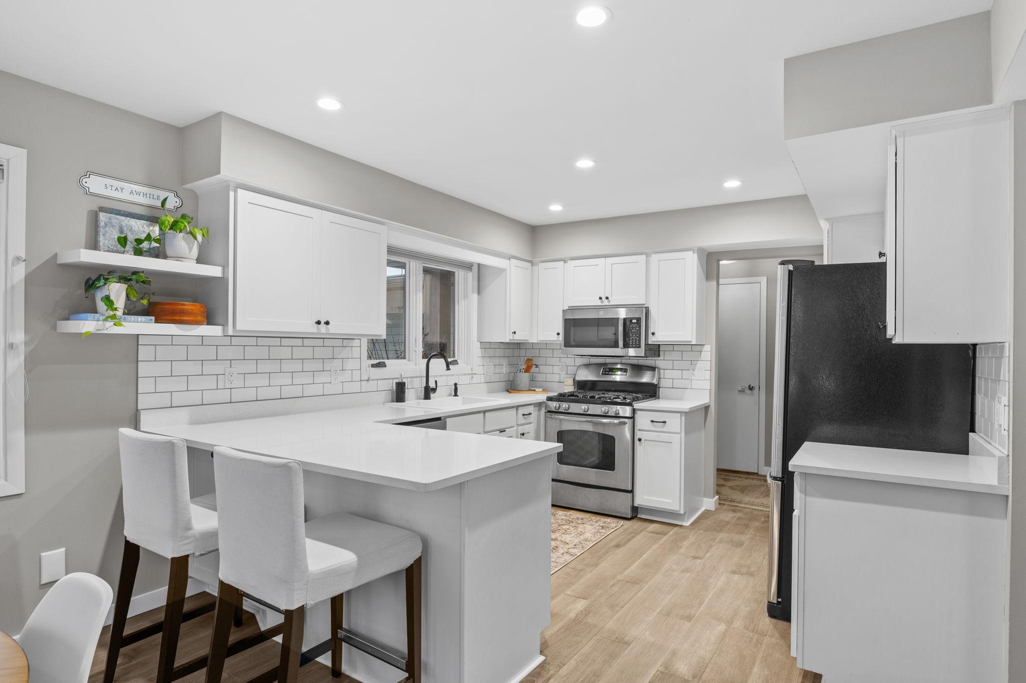 Another view of the amazing kitchen. The door through the entry will take you to the main floor laundry, mudroom, and oversized garage.