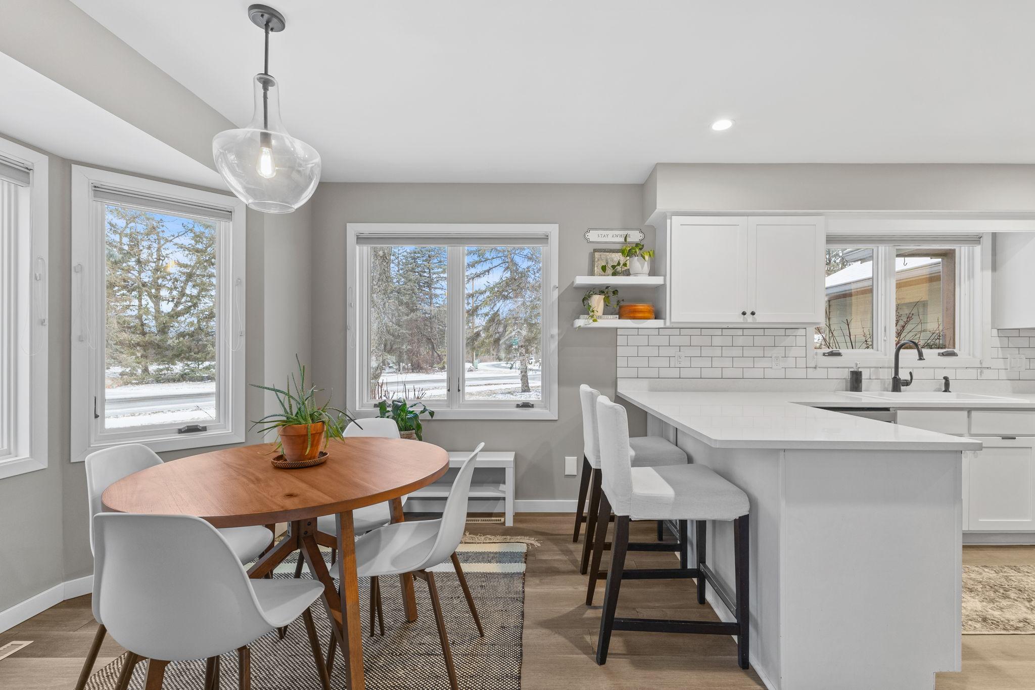 The multiple windows allow for amazing natural light through the entire kitchen and eat - in breakfast nook.