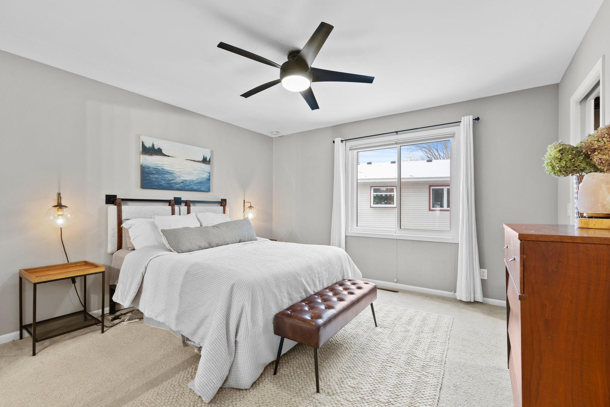 This is the walk-through master bedroom on the upper level, with the walk-in closet to the right and the beautifully updated bathroom to the left.