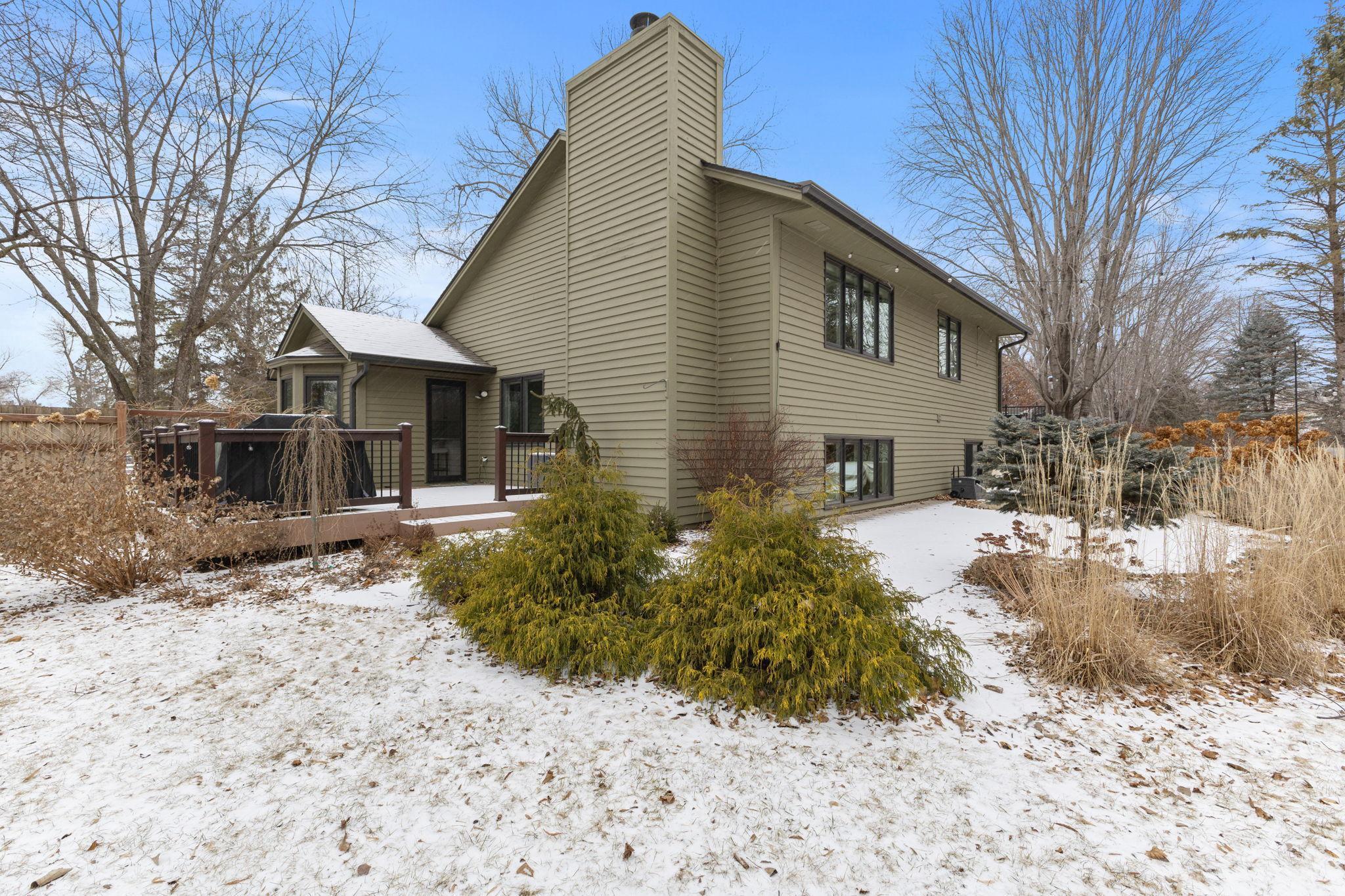 The home's exterior and landscaping during a Minnesota winter.