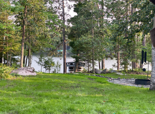 Summer view to dock and lift. firepit area.