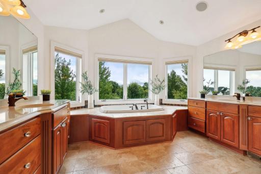 oversized soaking tub with separate vanities