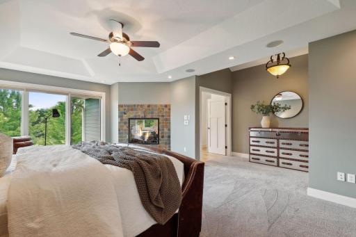 Primary bedroom offers a gas fireplace