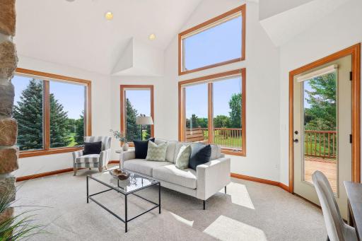 vaulted sunroom with gorgeous views