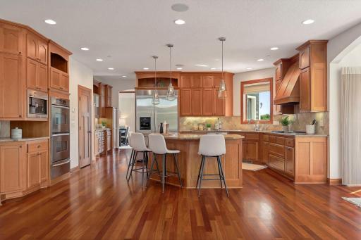 Custom solid wood cabinetry to the ceiling