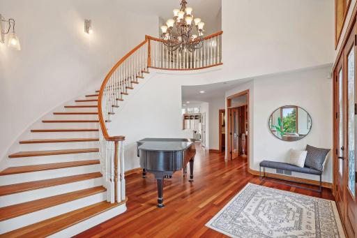 Grand wood staircase leading up to the 6 bedrooms on one level