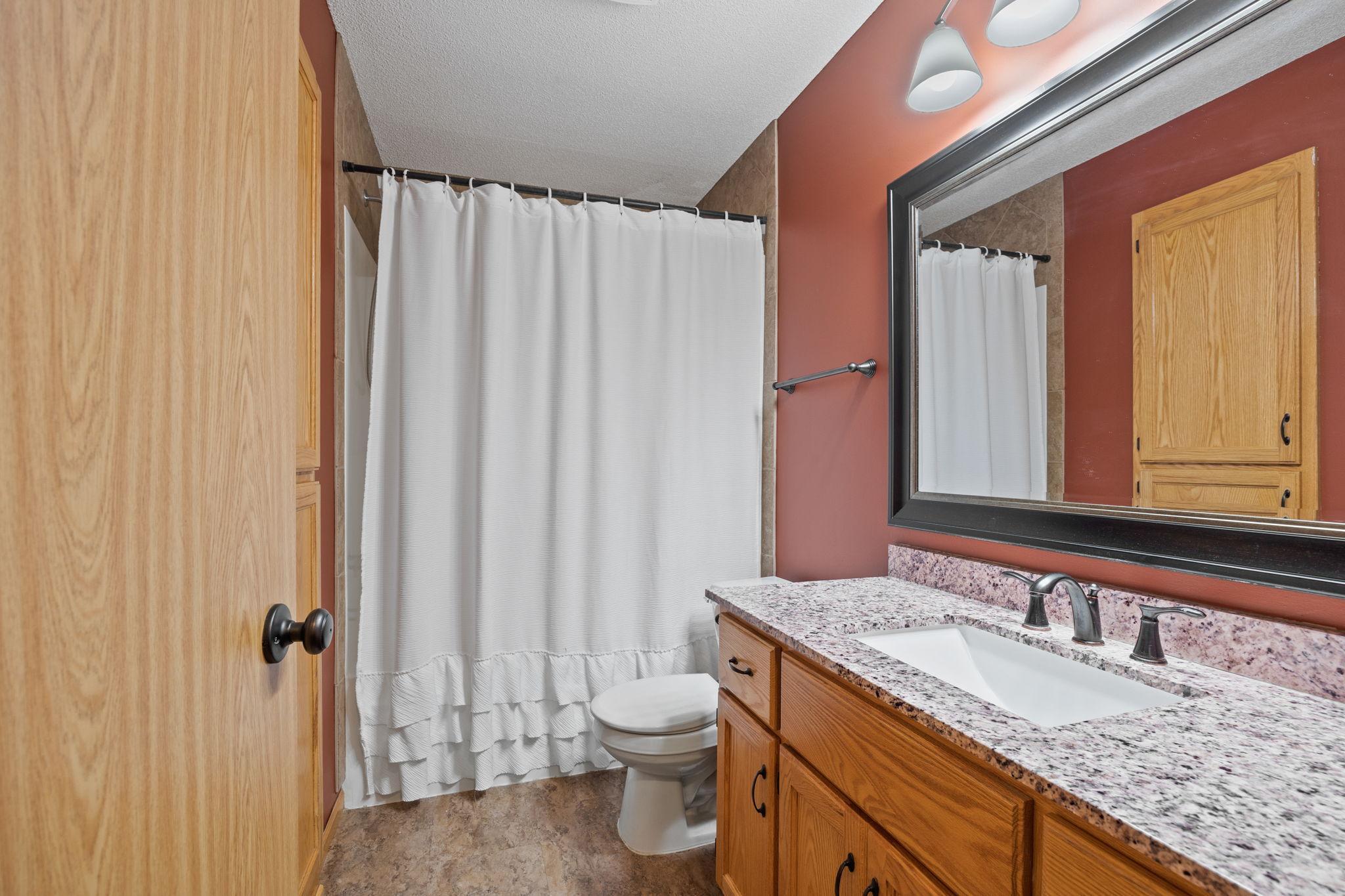 Main level full bath and beautiful granite top.