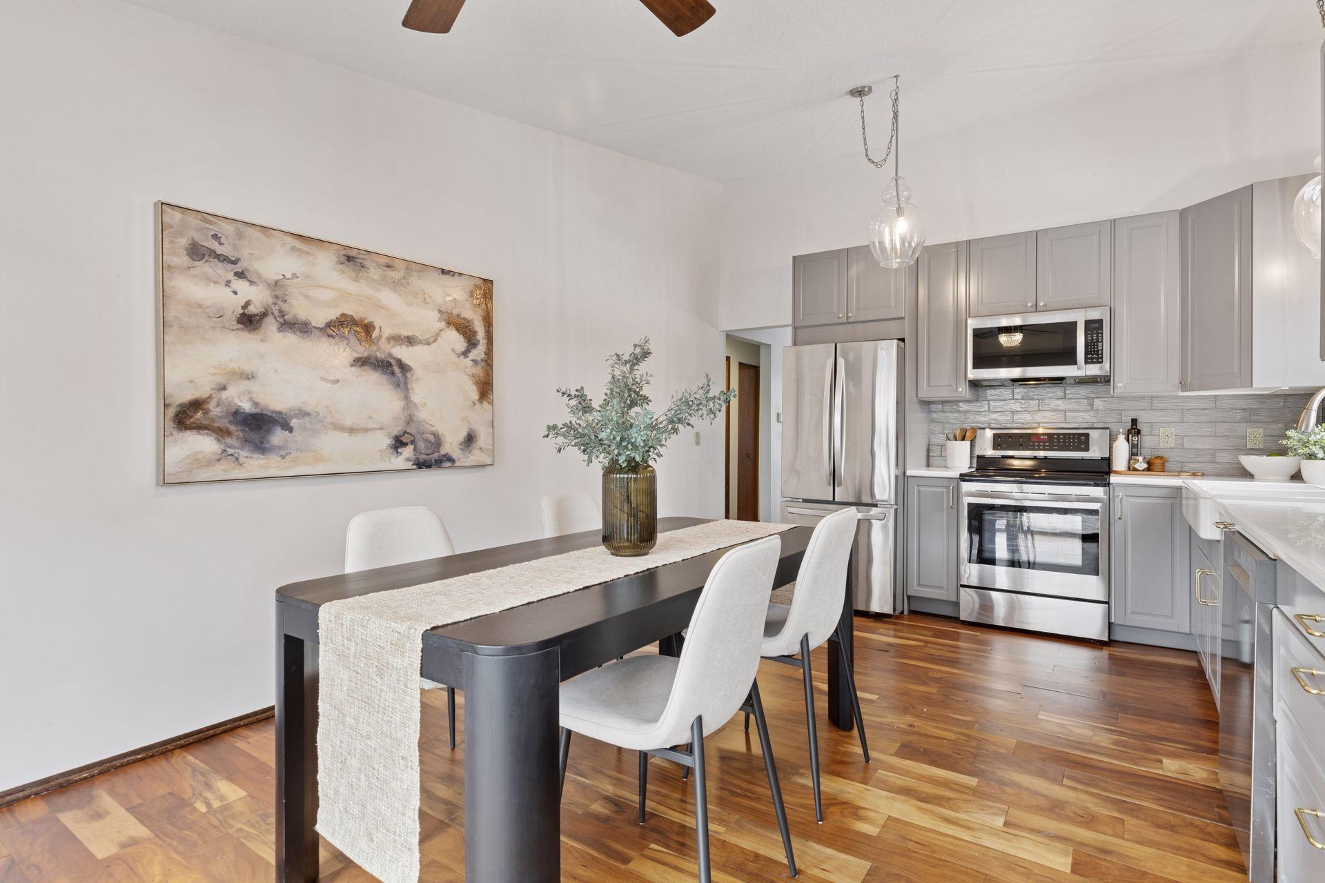 Plenty of room to put an eat-in style table against the wall, or as shown to have a large plank style table that extends for guests.