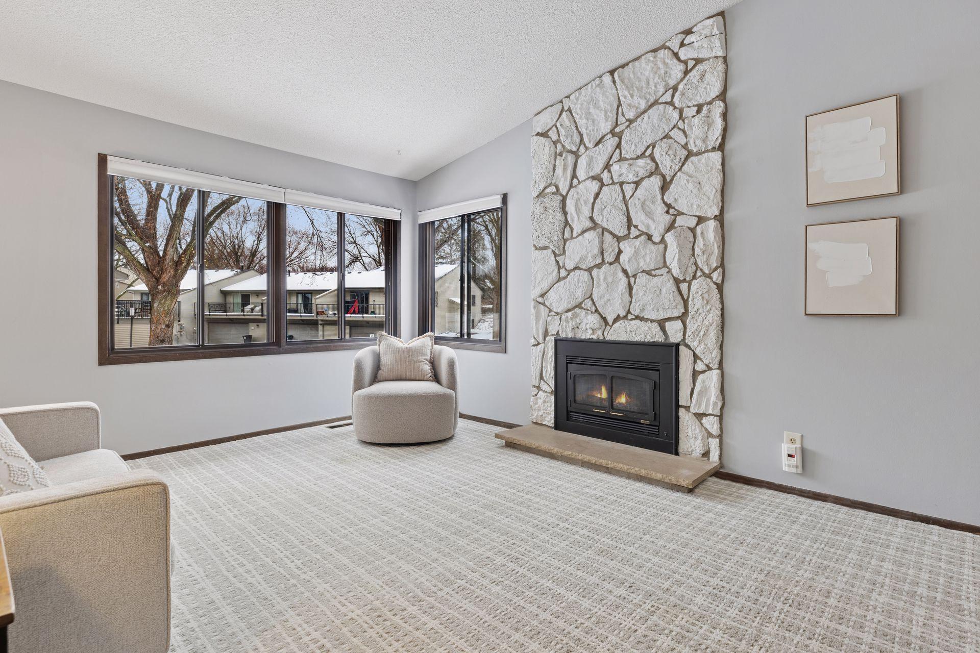Light and bright vaulted style living room with gas fireplace....