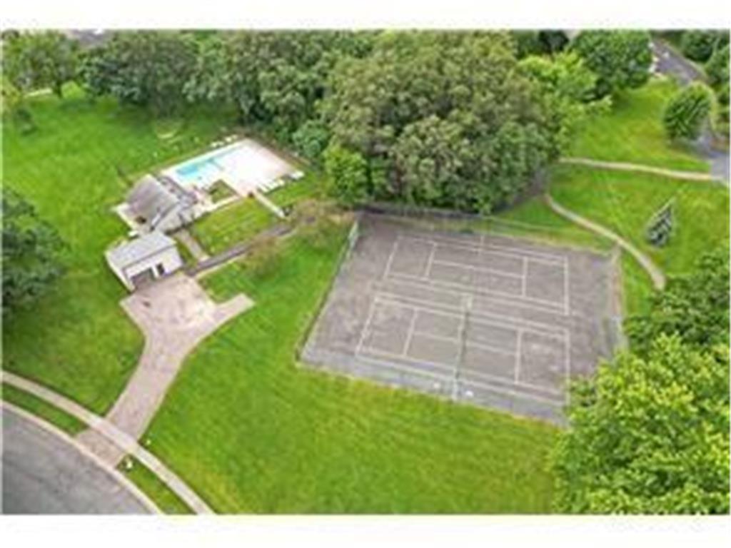 Aerial perspective showing the pool, pool house and tennis court