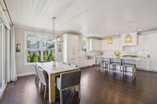 Open Concept Main Floor with Informal Dining Area that opens to the outdoor oasis