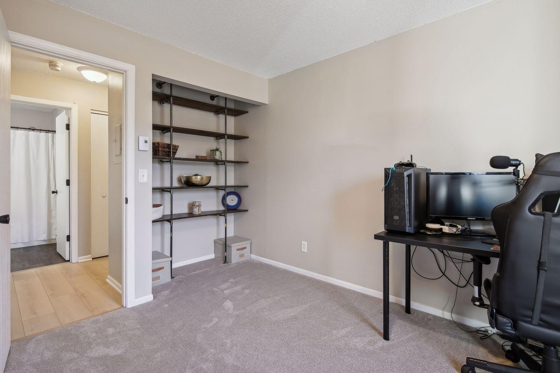 Second bedroom closet includes a custom shelving unit perfect for home office! A matching custom desk built in is avaiable for buyer