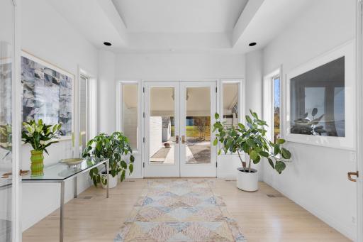 A refined foyer invites you filled with light, anticipation, and beauty