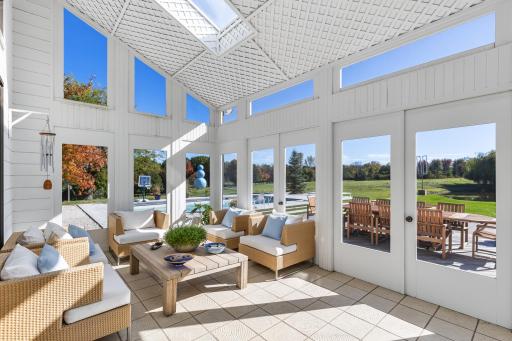 Sunroom drenched with natural light - soaring ceilings