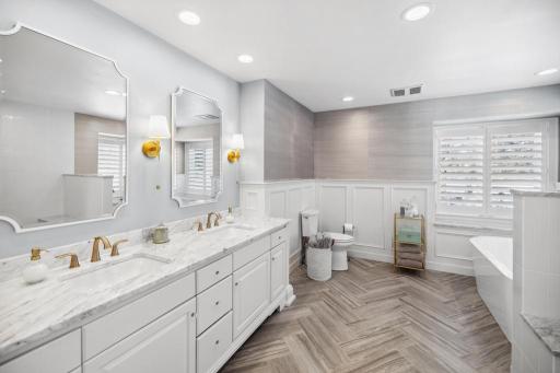 Heated floors welcome you as you step into the en-suite bathroom, where every detail is designed to create a spa-like experience.