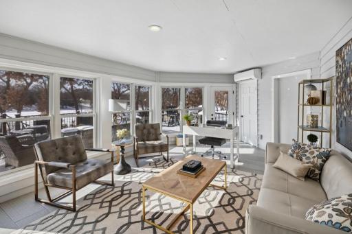 The 4-season sunroom is a versatile space where natural light pours in from every direction.