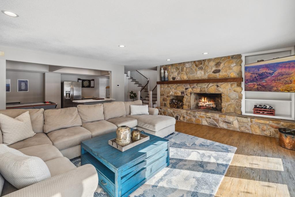This lower level family room is built for year-round entertaining!