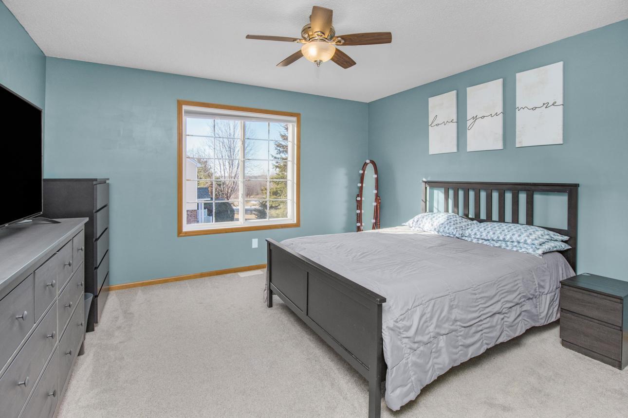 Primary bedroom is spacious, has tons of natural light and a wonderful walk-in closet.