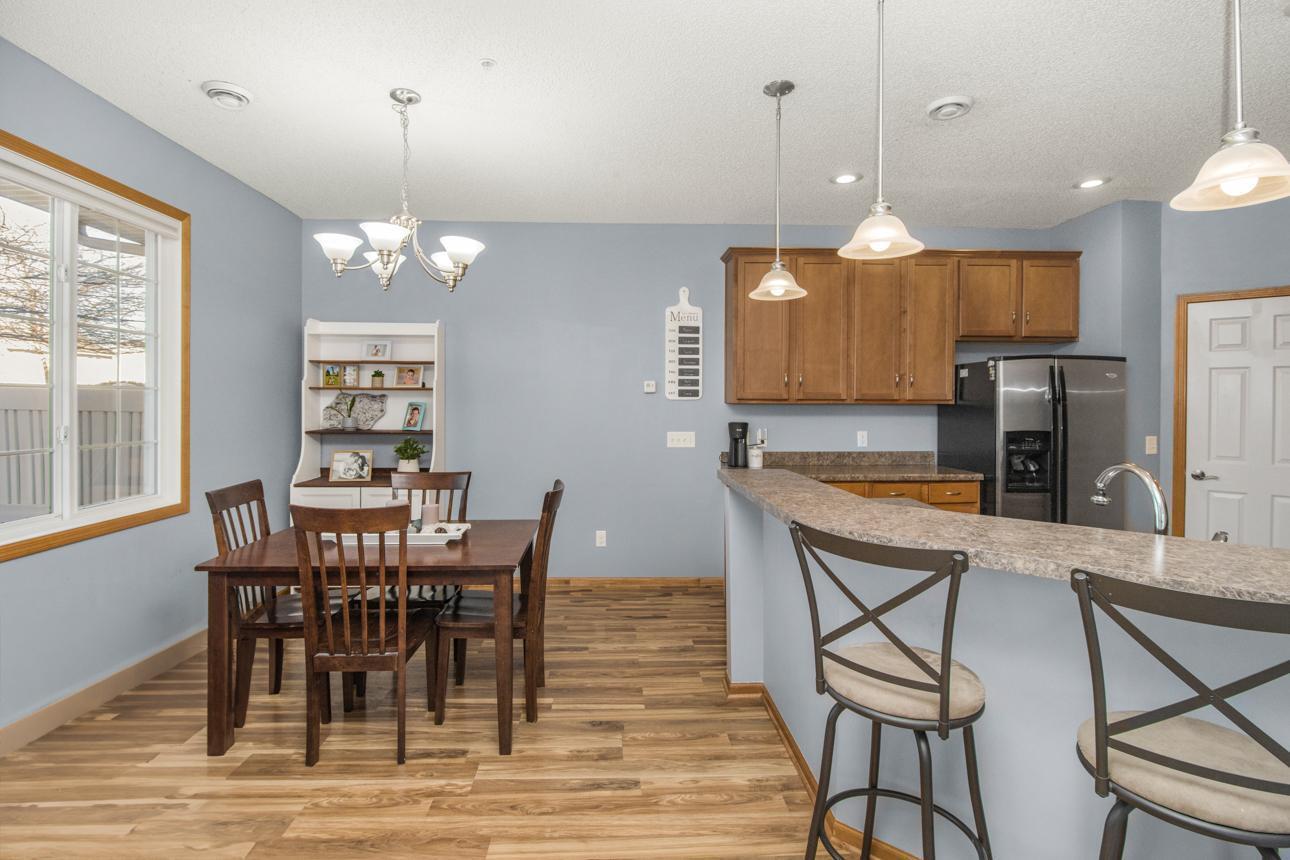 Low maintenance flooring, updated lighting and an expansive breakfast bar!