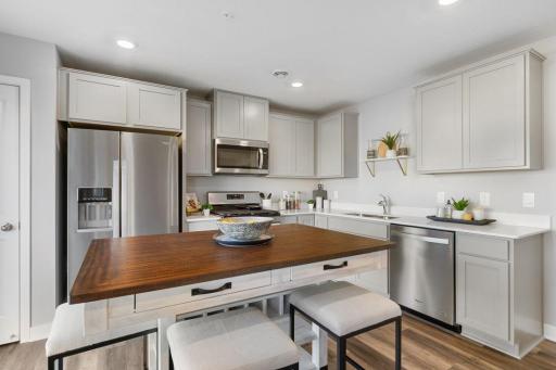 The appliance package included in the home features both a gas range and vented microhood - all of which is surrounded by a stunning finish to a space you'll love spending time in. (Photo of model, colors may vary).
