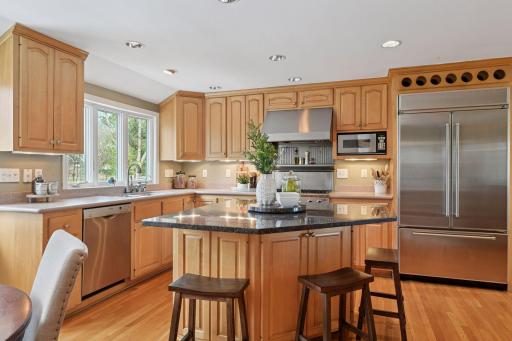 A kitchen fit for a chef with stainless steel appliances and a generous center island.