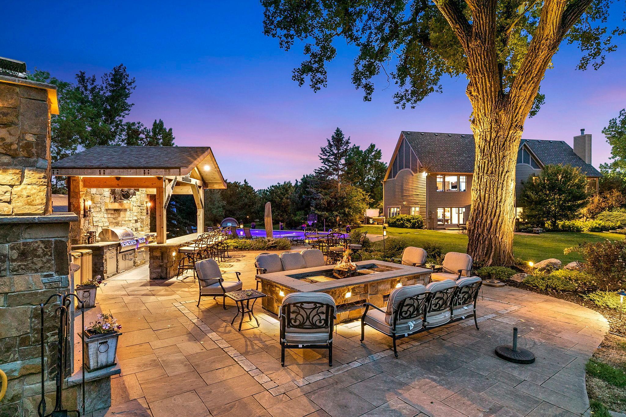 The incredible outdoor paradise - the outdoor kitchen, fireplace, pizza oven, fire table, patio, massive pool, gorgeous landscaping, exquisite lighting and sound system - you have to see it to believe it!