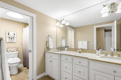 Lower level Full Bathroom with double vanity, and in-floor heating.