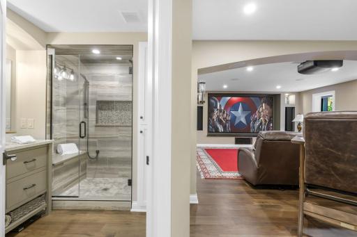 This multi-purpose space is a wonderful mother-in-law suite with a murphy bed, kitchenette, and luxurious 3/4 bathroom - and also an incredible and very comfortable theater room for everyone to enjoy!